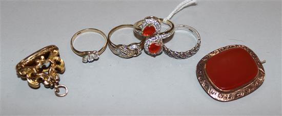 Four 9ct and gem set rings, a late Victorian 9ct gold and carnelian brooch and gilt metal fob seal.